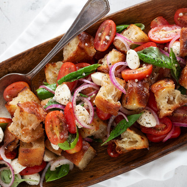 Focaccia panzanella in a wooden salad bowl.