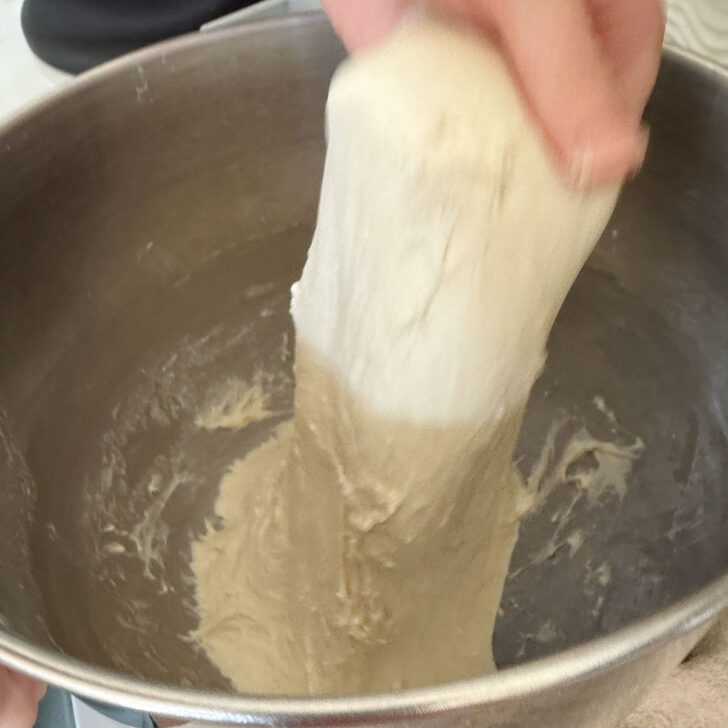 Stretching and folding the focaccia dough.