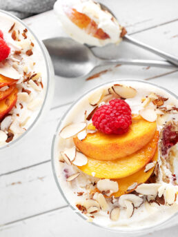 No-bake creamy peach melba dessert in individual serving cups.