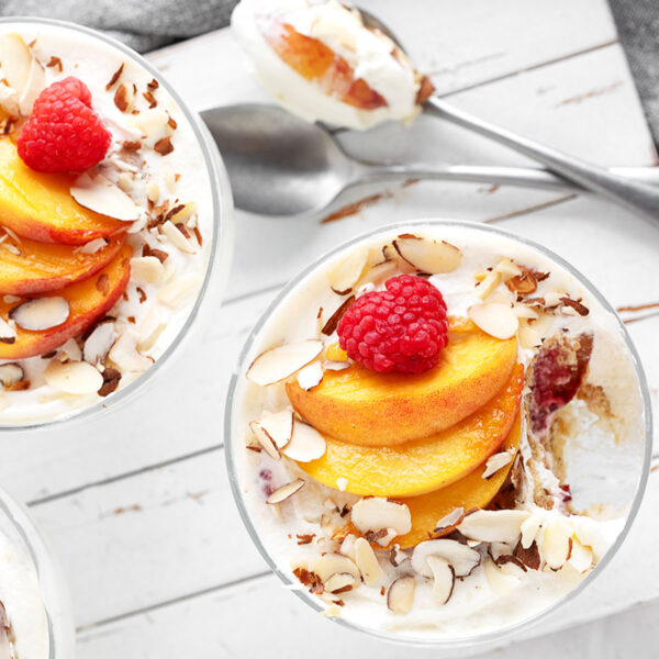 No-bake creamy peach melba dessert in individual serving cups.