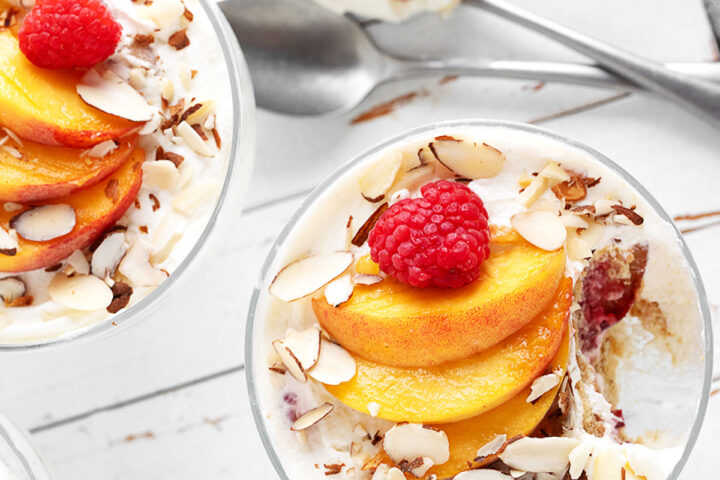 No-bake creamy peach melba dessert in individual serving cups.