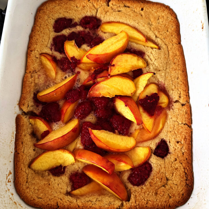 Baked peach melba spoon cake.