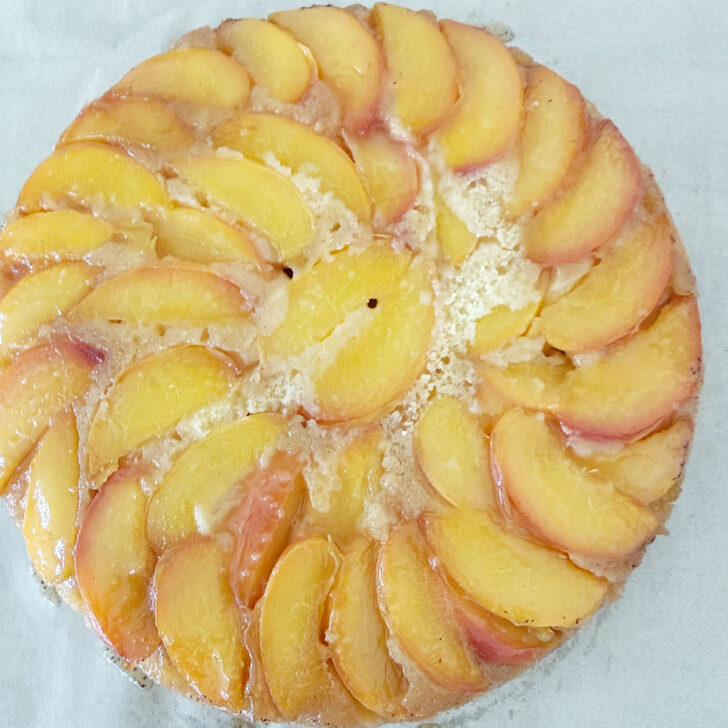 Peach upside down cake after flipping out of the cast iron skillet.