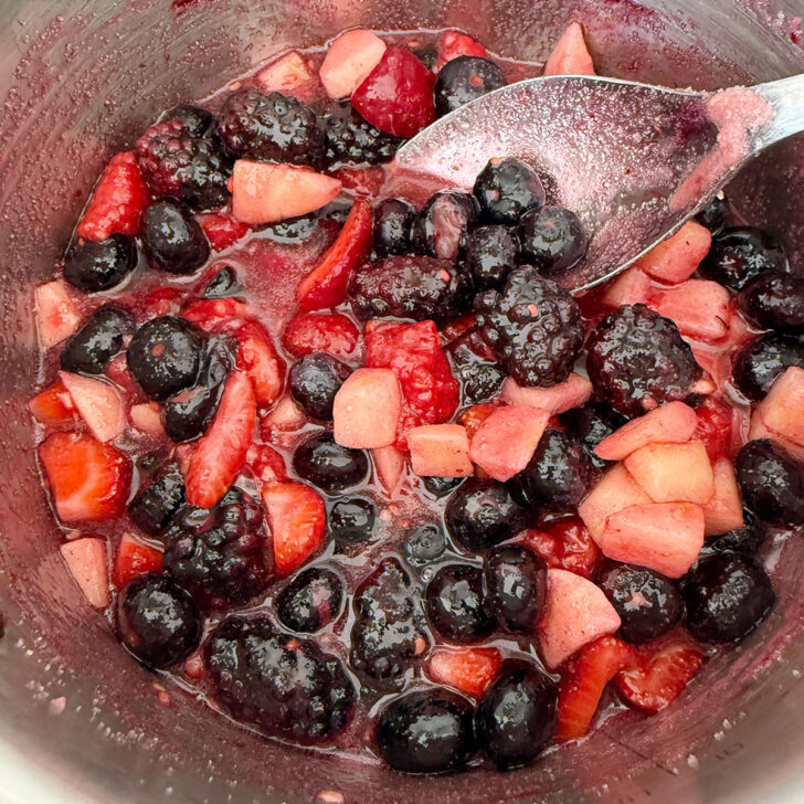 Fresh fruit cooking in the sauce pan with the sugar.