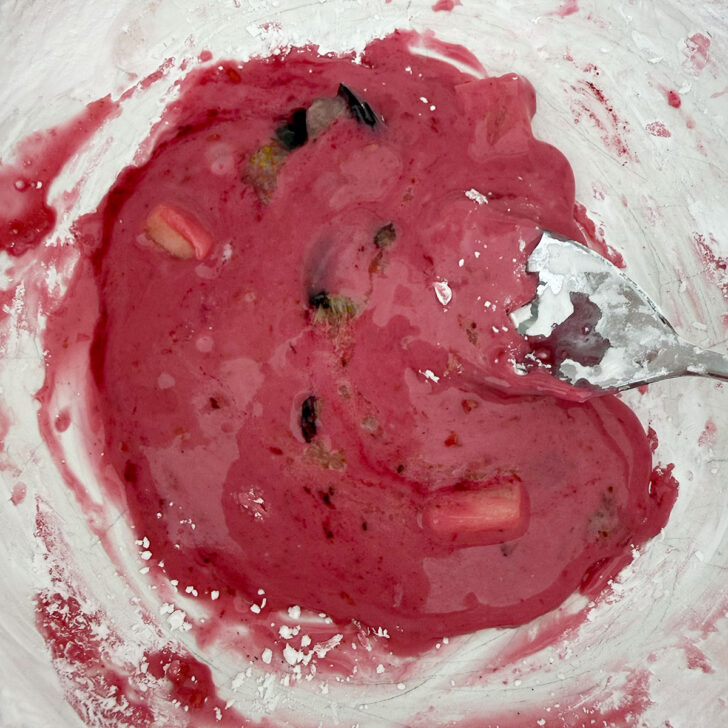 Making a paste of cornstarch and juices from the fruit.