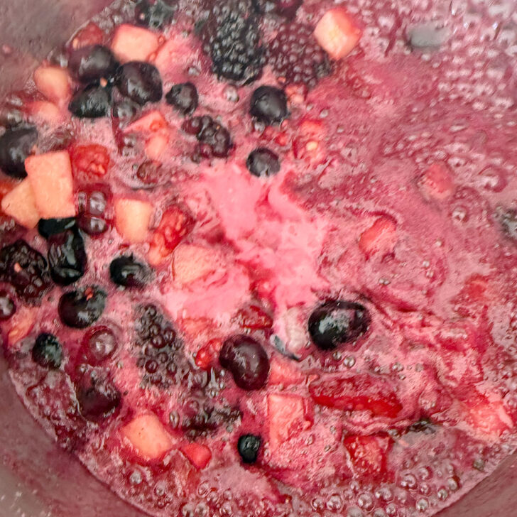 Cornstarch paste added to the saucepan with the fruit.