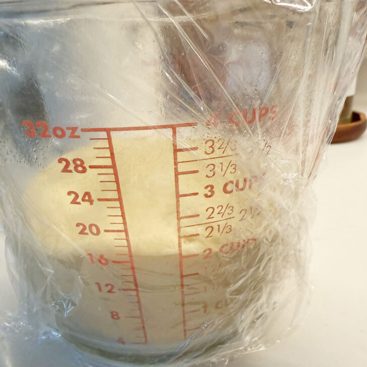 Kuchen dough set to rise in a bowl.