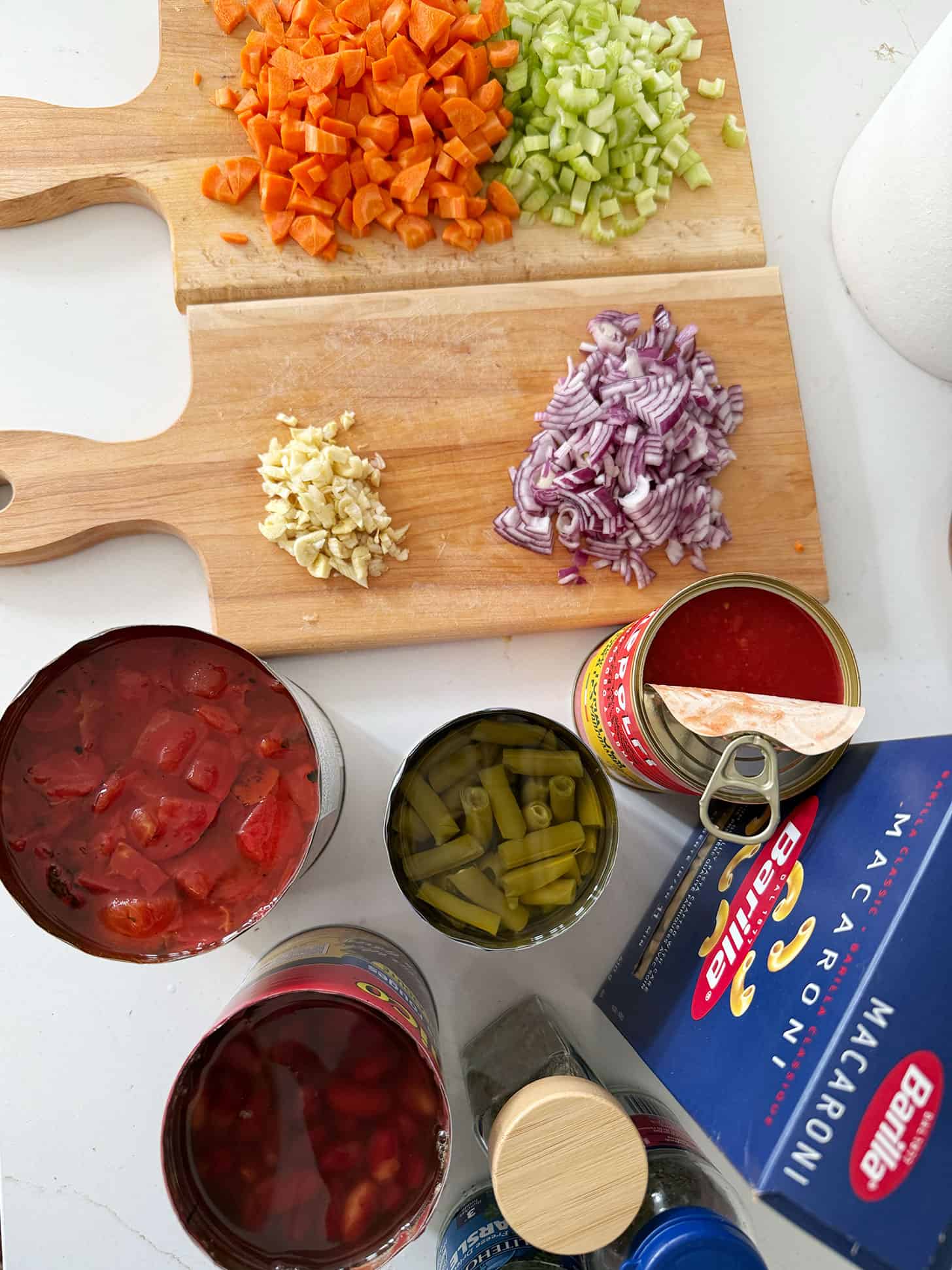 Ingredients for minestrone soup on the counter before cooking.