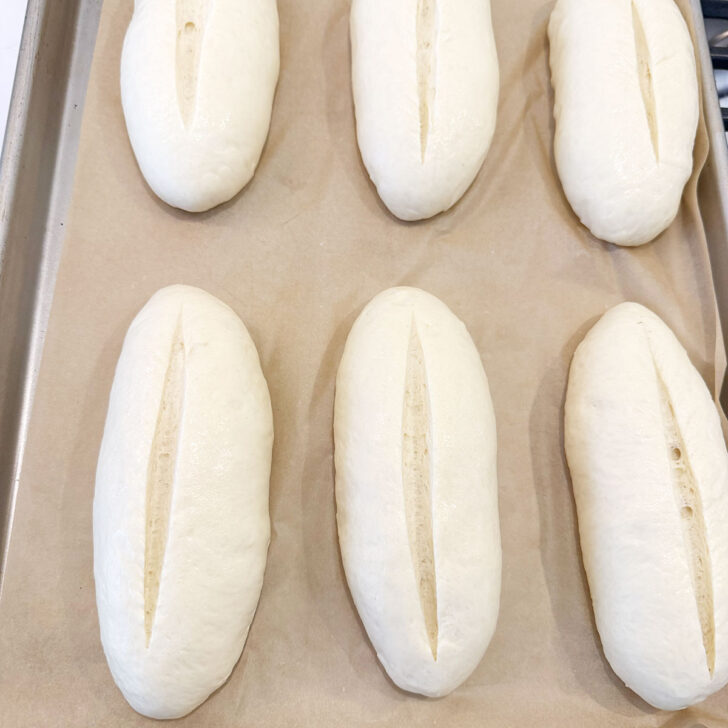 Buns slashed with a sharp knife before baking.