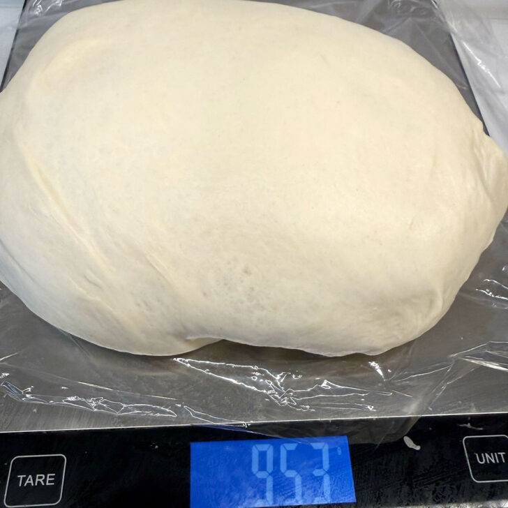 Weighing the dough on a kitchen scale.