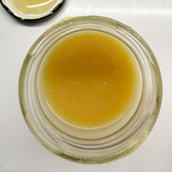 Maple mustard vinaigrette in a jar after shaking.