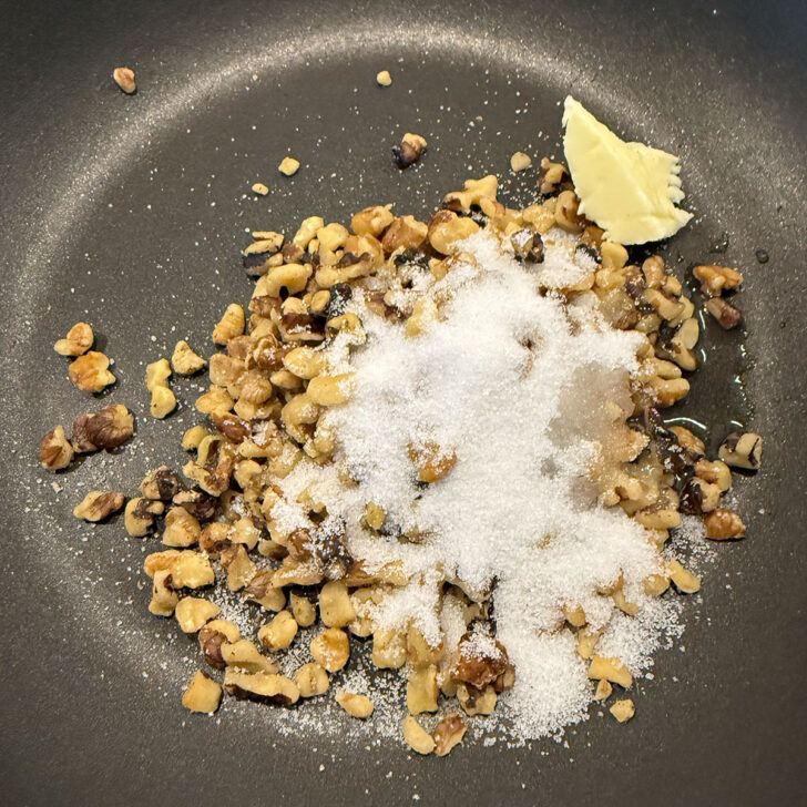 Quick-candied walnut ingredients placed into a non-stick skillet.