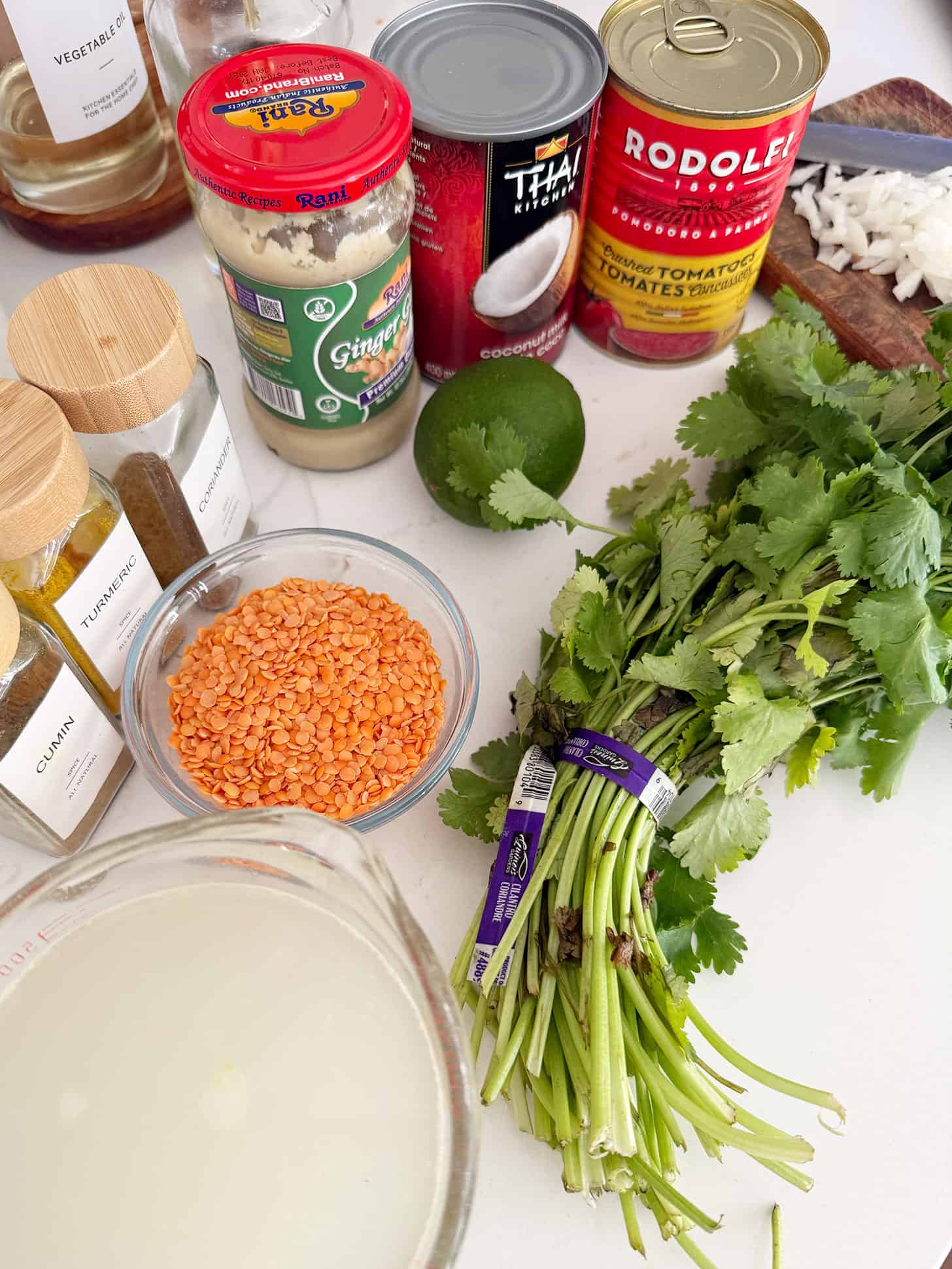 Ingredients assembled for tomato coconut curry lentil soup.