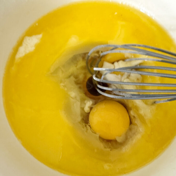 Mixing the wet ingredients together in a bowl.